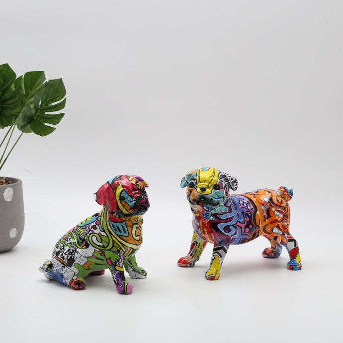 Image of two multicolor pug statues