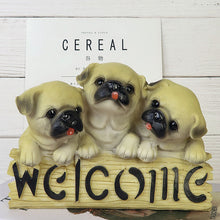 Load image into Gallery viewer, image of three pugs in a dog welcome staue