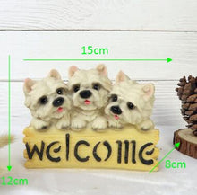 Load image into Gallery viewer, image of three west highland terriers in a dog welcome staue