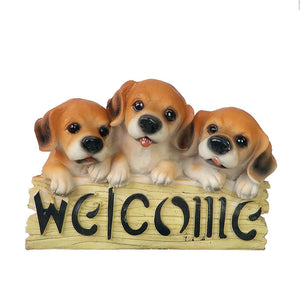 image of three beagles in a dog welcome staue