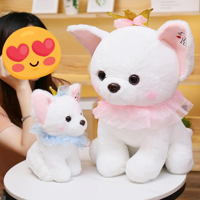 A girl with two white Chihuahua stuffed animal plush toys in different sizes