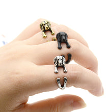 Load image into Gallery viewer, Image of three Beagle rings wrapped on the finger of a person in three colors including Antique Silver, Bronze, and Black Gunmetal
