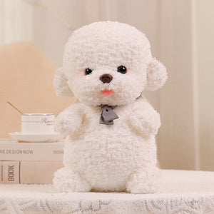image of a cute white color bichon frise stuffed animal plush toy sitting on a tablecloth