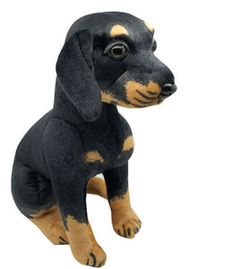 image of an adorable rottweiler stuffed animal plush toy on a table