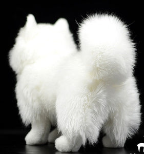 image of an adorable white samoyed stuffed animal plush toy in black background - backview