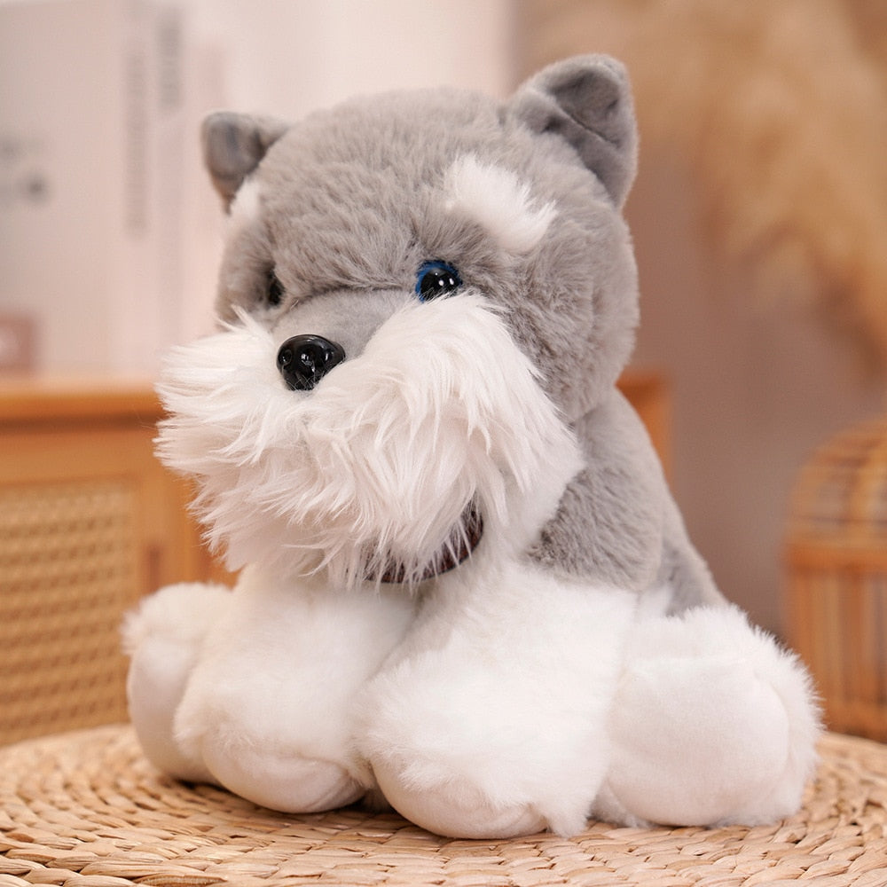 image of an adorable schnauzer stuffed animal plush toy sitting on a mat