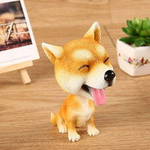 Load image into Gallery viewer, Image of a smiling Shiba Inu bobblehead sitting on the floor