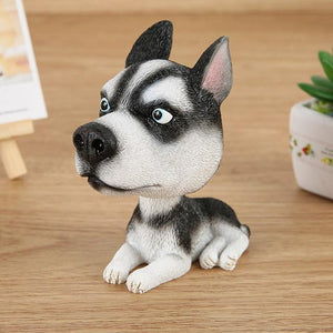 Image of a Husky bobblehead sitting on the floor