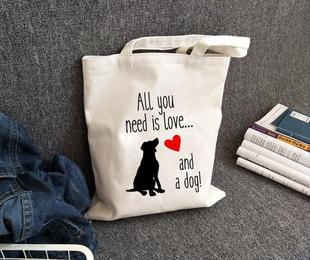 All You Need Is Love and A Dog Canvas Tote BagsAccessoriesAll you need is love and a dog - black dog and red heart