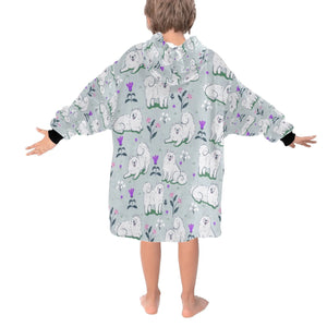 Image of a girl wearing an American Eskimo Dog blanket hoodie for kids in grey color - Back View