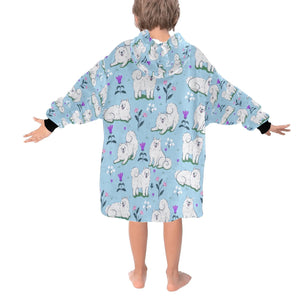 Image of a girl wearing an American Eskimo Dog blanket hoodie for kids in light blue color - Back View