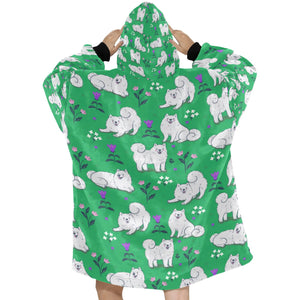 Image of a lady wearing an American Eskimo Dog blanket hoodie for women in green color - Back View