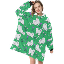 Load image into Gallery viewer, Image of a lady wearing an American Eskimo Dog blanket hoodie for women in green color