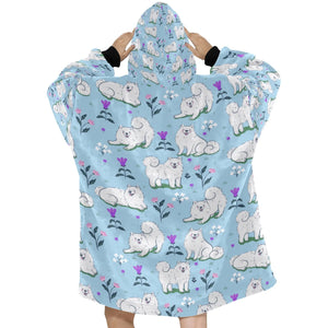 Image of a lady wearing an American Eskimo Dog blanket hoodie for women in light blue color - Back View