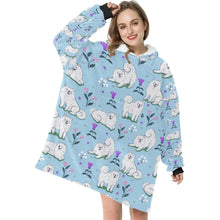 Load image into Gallery viewer, Image of a lady wearing an American Eskimo Dog blanket hoodie for women in light blue color