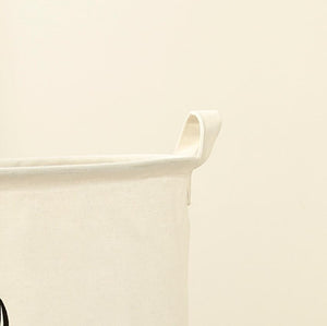 Image of an adorable American Eskimo Dog laundry basket handle design