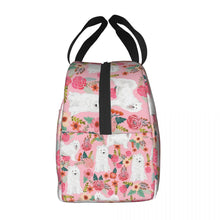 Load image into Gallery viewer, Side image of an insulated American Eskimo Dog lunch bag with exterior pocket in bloom design