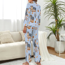 Load image into Gallery viewer, image of a woman wearing a blue pajamas set with autumn leaves design - back view