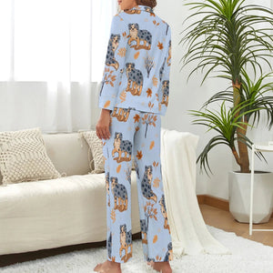 image of a woman wearing a blue pajamas set with autumn leaves design - back view