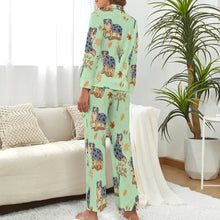 Load image into Gallery viewer, image of a woman wearing a green pajamas set with autumn leaves design - back view