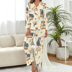 image of a woman wearing a beige pajamas set with autumn leaves design - 