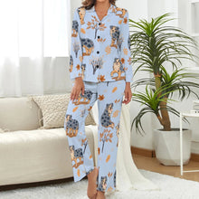 Load image into Gallery viewer, image of a woman wearing a blue pajamas set with autumn leaves design