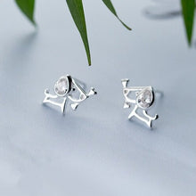 Load image into Gallery viewer, Image of two Beagle earrings on a table - top view