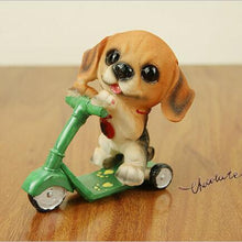 Load image into Gallery viewer, Image of a Beagle figurine in the most adorable Beagle riding a green kickboard scooter design