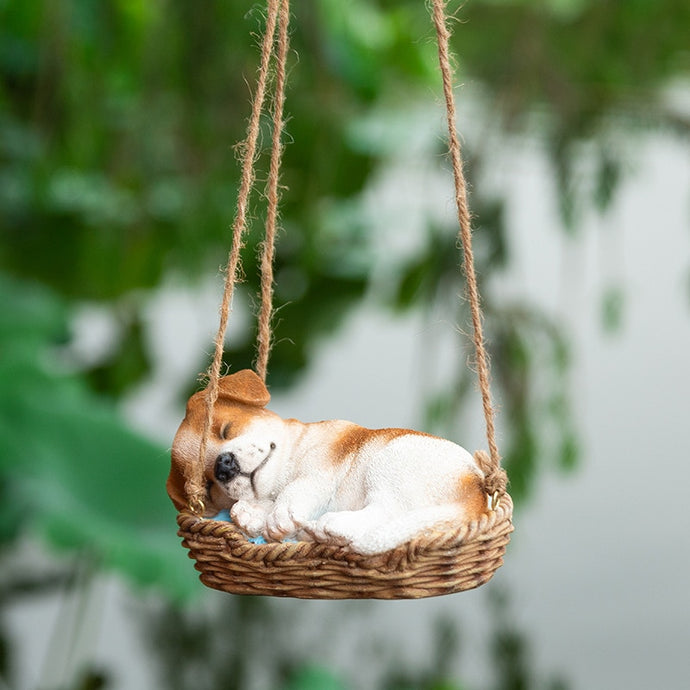 Image of a super cute sleeping and hanging Beagle garden statue
