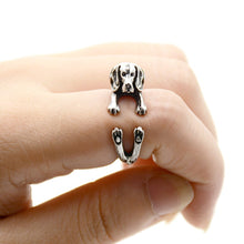 Load image into Gallery viewer, Front image of a finger wrap Beagle ring on the finger of a person in the color Antique Silver