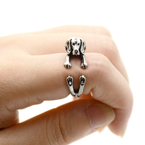 Front image of a finger wrap Beagle ring on the finger of a person in the color Antique Silver
