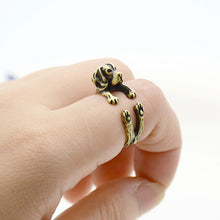 Load image into Gallery viewer, Image of a finger wrap Beagle ring on the finger of a person in the color Antique Bronze