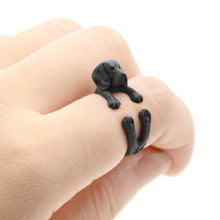 Load image into Gallery viewer, Image of a finger wrap Beagle ring on the finger of a person in the color Black Gun