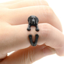 Load image into Gallery viewer, Front image of a finger wrap Beagle ring on the finger of a person in the color Black Gun