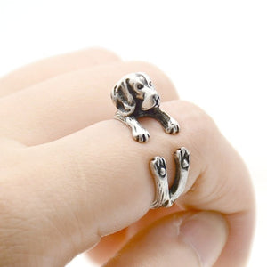 Image of a finger wrap Beagle ring on the finger of a person in the color Antique Silver