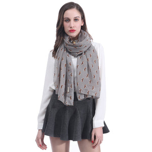 Image of a lady wearing an infinite print Beagle scarf in the grey color