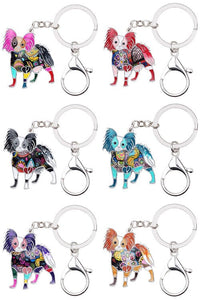 Image of six Papillon keychains made of enamel in different colors
