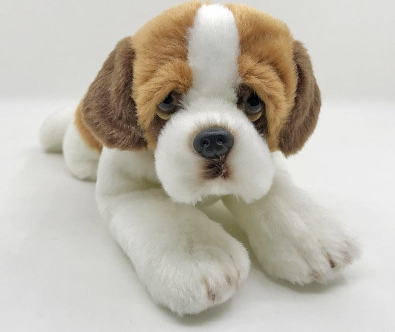 This image shows a cute Belly Flop Saint Bernard Stuffed Animal Plush Toy looking at you while lying on the floor.