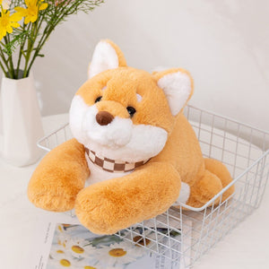 This image  shows an adorable Shiba Inu Stuffed Animal sitting on a basket .