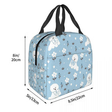 Load image into Gallery viewer, Image of the size of an insulated Bichon Frise lunch bag with exterior pocket in bowtie bichon frise design