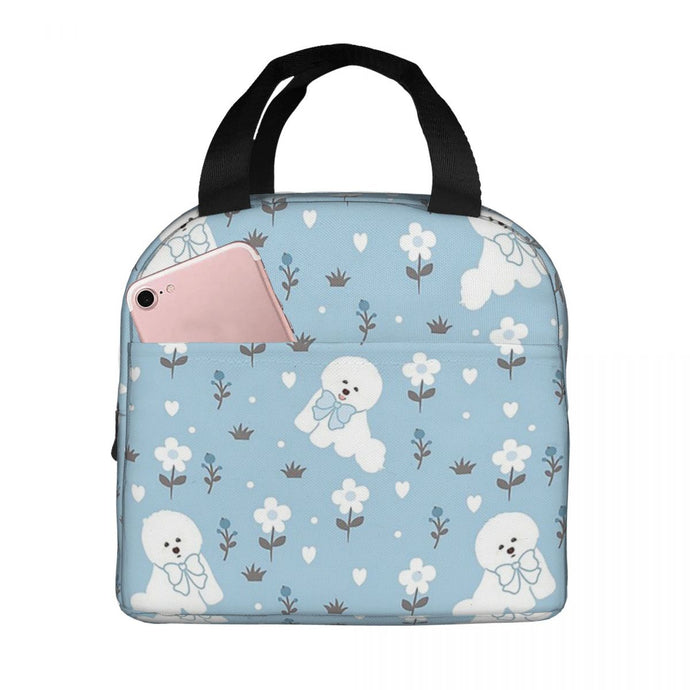Image of an insulated Bichon Frise lunch bag with exterior pocket in bowtie bichon frise design