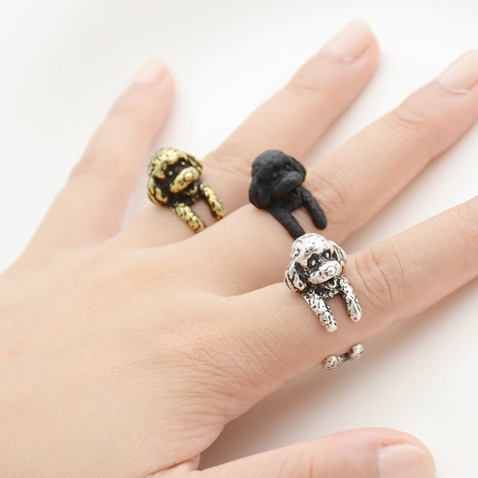 Image of an adorable Bichon Frise finger wrap rings in the color antique silver, antique bronze, and black gun
