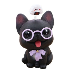 Image of french bulldog bobblehead in the smiling Black Frenchie babyface, wearing light purple glasses, a matching bow-tie, with a bouncy white momo on his or her mind