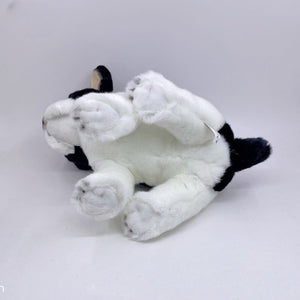 This image shows a lying blue pied French Bulldog Stuffed Animal plush toy on the floor.