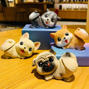 Image of four dog bobbleheads in the the cutest bobble-butt design including Pug, Frenchie, Husky, and Corgi boblehead