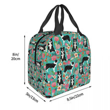 Load image into Gallery viewer, Image of the size of an insulated Border Collie lunch bag with exterior pocket in bloom design
