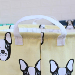 Close up image of a cream color boston terrier laundry basket