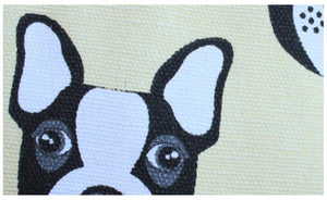Close up image of a cream color boston terrier laundry basket