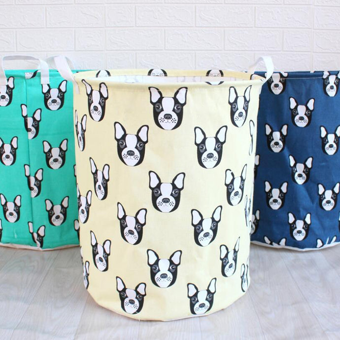 Image of three boston terrier laundry baskets in the color green, cream, and blue