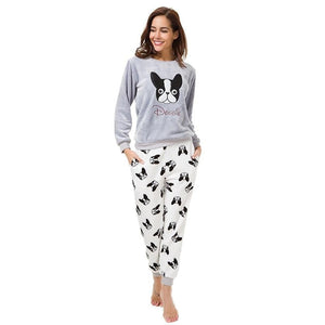 Image of a girl wearing boston terrier pajama set in the cutest warm fleece fabric